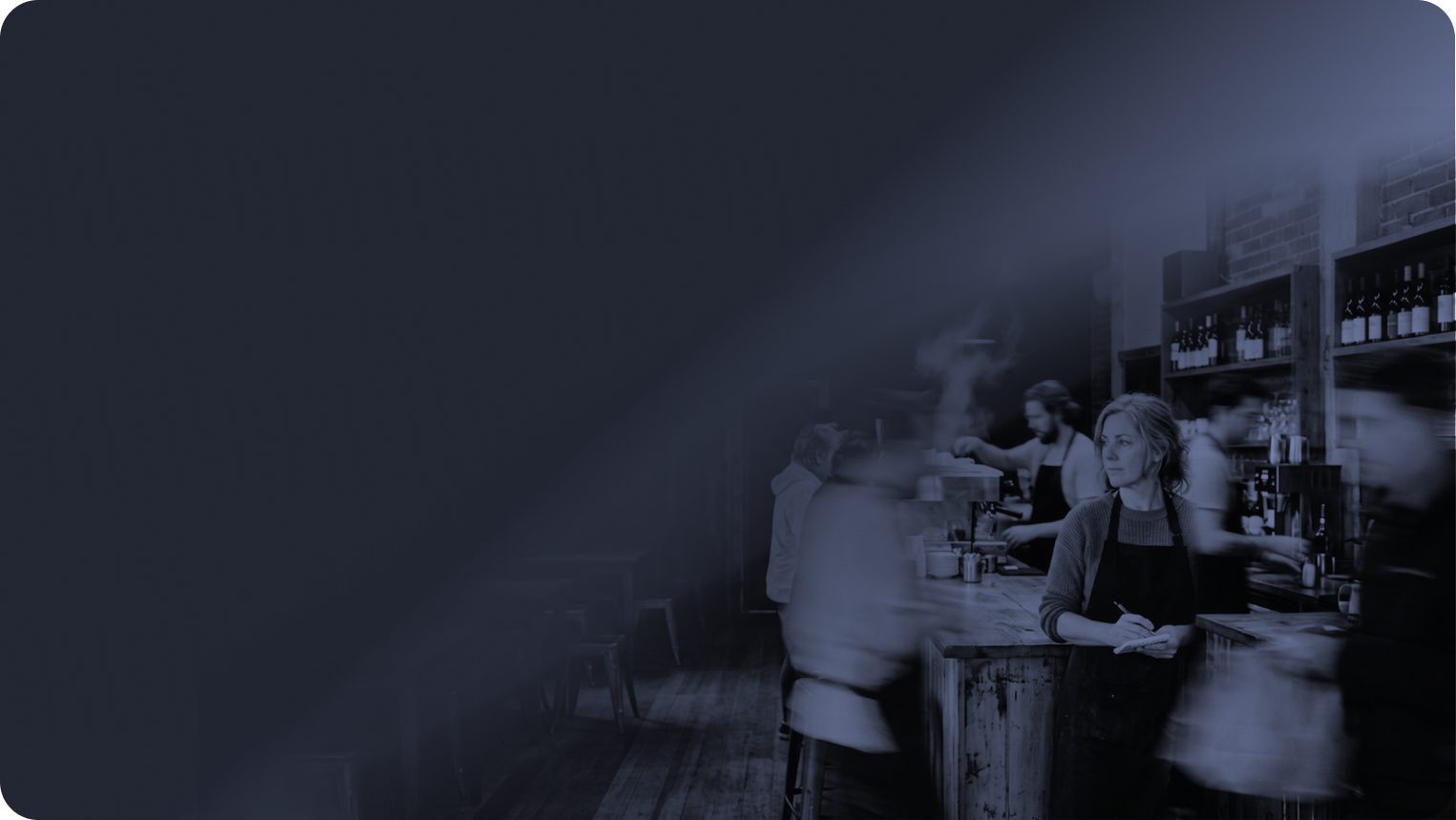Cafe owner working the counter during a busy service