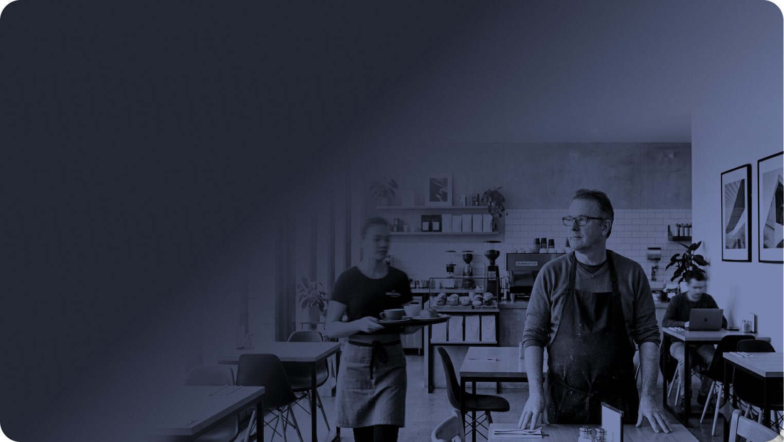 Cafe owner standing in his fit-out during service