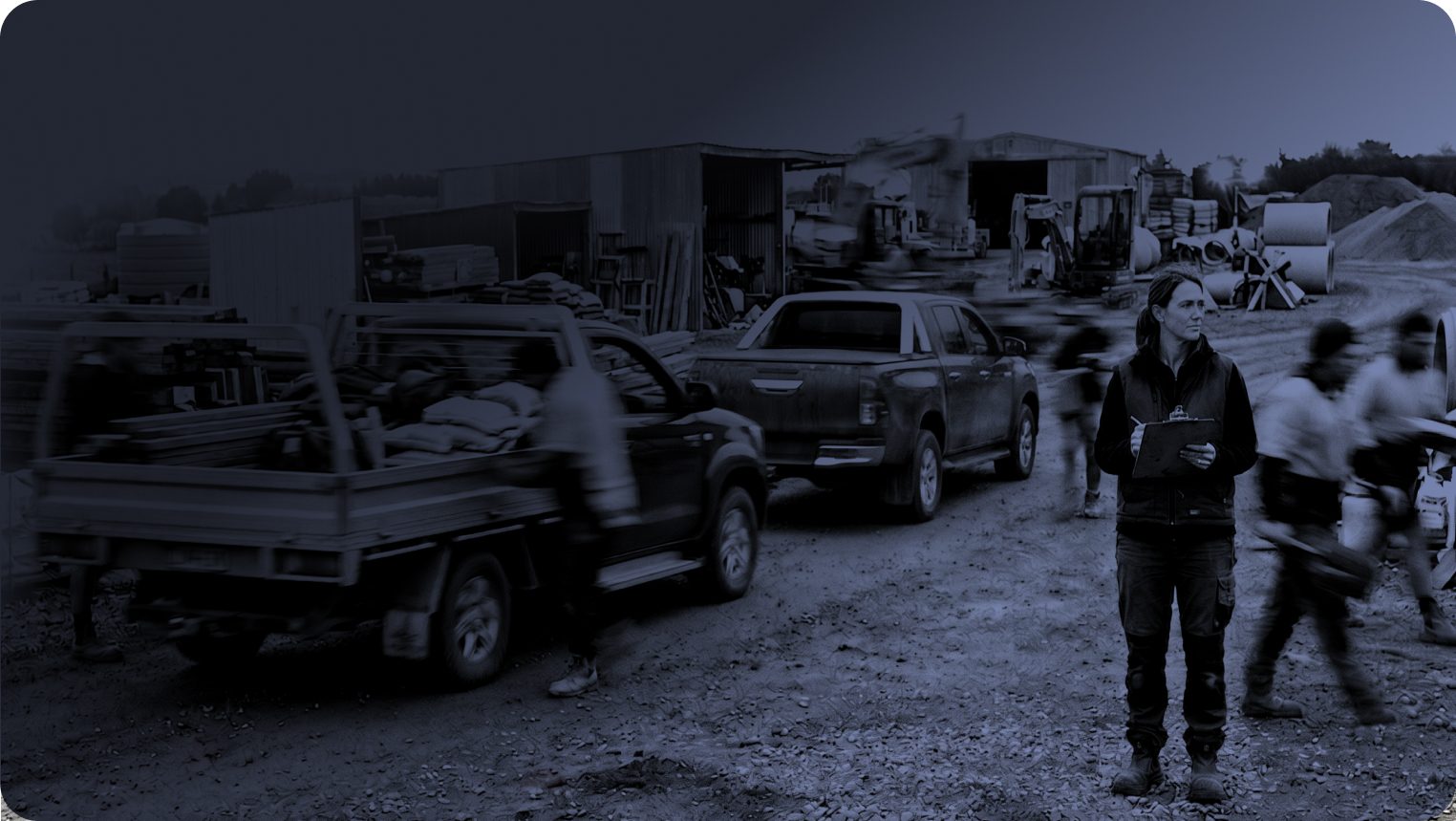 Business owner with a clipboard at a busy equipment yard
